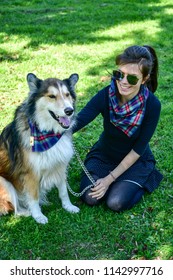 Matching Dog And Owner Outfit. Girl And Her Collie Dog  With Matching Bandana