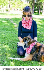 Matching Dog And Owner Outfit. Girl And Her Collie Dog  With Matching Bandana