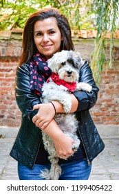 Matching Dog And Owner Outfit.  Smiling Woman And Her Dog  With Matching Bandana