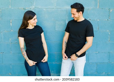 Matching T Shirts. Young Couple Feeling Happy After They Had T-shirts Made With The Same Designs