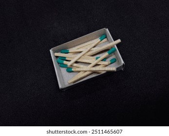 A matchstick is a small, slender stick with a combustible head. Striking it against a rough surface ignites the head, producing a flame used to light candles, stoves, or fires. - Powered by Shutterstock