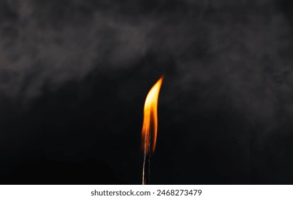 Matchstick warm light , light matches against  dramatic smoke mist effect in background. Copy space for text or logo. - Powered by Shutterstock