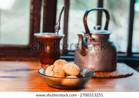 Mate with chipá on the kitchen table, a typical breakfast from Misiones