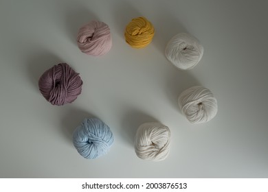 The Material For Weaving Macrame. Colored Cotton Twine, Threads On A White Background.