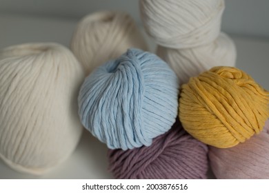 The Material For Weaving Macrame. Colored Cotton Twine, Threads On A White Background.