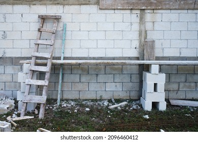 Materials arranged to make a platform in a low cost construction site using cement blocks.
