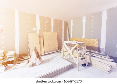 Materials for construction - putty packs, sheets of plasterboard or drywall- in apartment is under construction, remodeling, renovation, extension, restoration and reconstruction. 