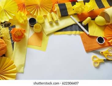 Materials for creativity. Children's creativity. Creative process. White background. Colors yellow,black and orange.