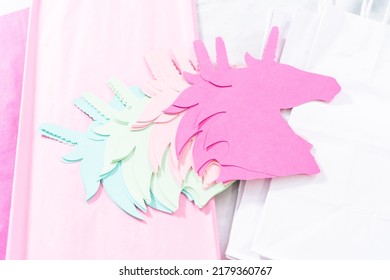 Materials to make unicorn Birthday party favor bags for a little girl's Birthday party.