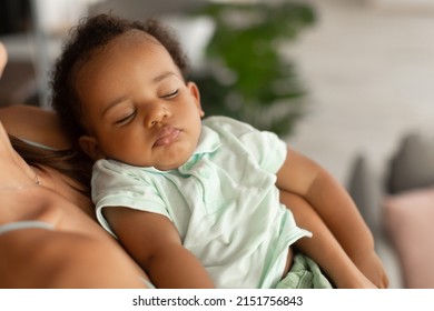 Maternity Concept. Closeup Of African American Woman Holding Her Adorable Small Sleeping Black Baby On Hands, Singing Lullaby, Comforting Infant Kid Standing In Bedroom At Home