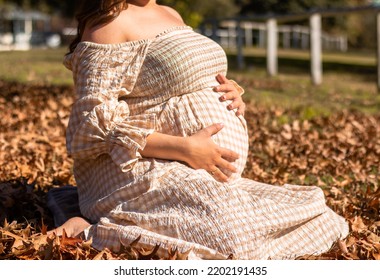 Maternity And Pregnancy Photoshoot Showing A Females Baby Bump