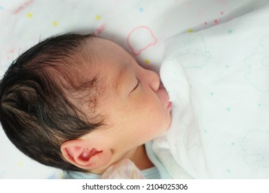 In Maternity Ward - Hospital, Newborn Lay On Bassinet With Innocent Face And Peaceful.