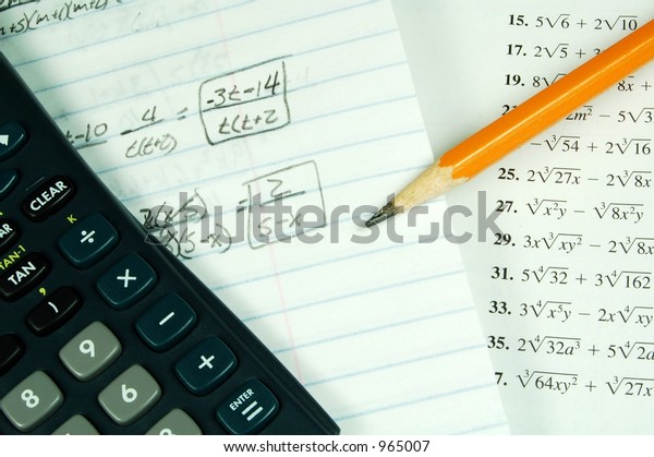 A math book\
with a calculator and math\
paper