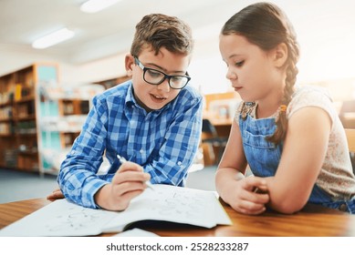 Math, children or students writing in library for education, child development or learning in junior grade together. Problem solving, school or team or kids with book, help or support for solution - Powered by Shutterstock