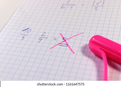 A math example and teacher found some mistake. He used pink pen for check it out this result. Exam time