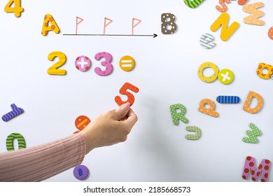 Math Lesson Example For Beginner In Elementary School. Math Lesson. Numbers On A White Board. Back To School Concept