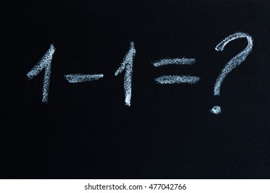 mathematical elementary school equation problem written on a chalkboard