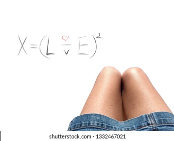 Mathematical numerical algebraic equation for love (X equals love to the power two) handwritten white background and woman’s knees together in heart shape  Romantic message