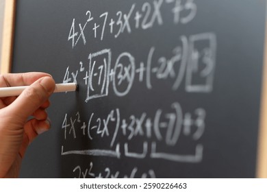 Mathematical operations and algebra mathematic formula written with chalk on the blackboard