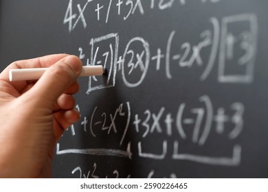 Mathematical operations and algebra mathematic formula written with chalk on the blackboard