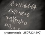 Mathematical operations and algebra mathematic formulas written with chalk on the blackboard