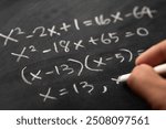 Mathematical operations and algebra mathematic formulas written with chalk on the blackboard