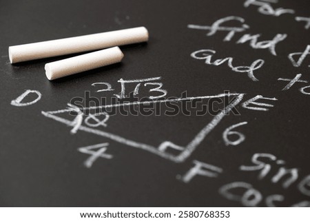 Mathematical operations and trigonometry mathematic formula written with chalk on the blackboard