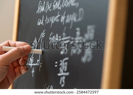 Mathematical operations and trigonometry mathematic formula written with chalk on the blackboard
