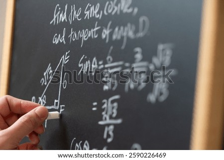 Mathematical operations and trigonometry mathematic formula written with chalk on the blackboard