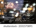 Mathematical and physics equations of Albert Einstein and Sir Isaac Newton and other equations on black background.