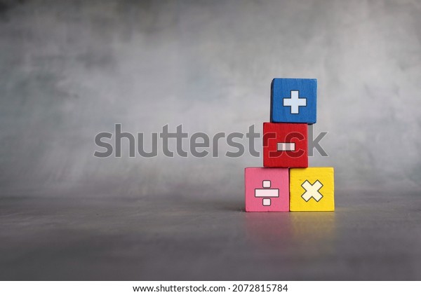 Mathematical symbols and\
education concept. Wooden blocks with mathematical symbols. Copy\
space for text.
