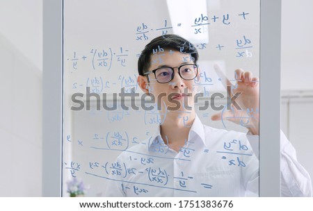 mathematicians concept. Handsome man thinking on white background, graphic image idea, man mathematicians are calculating with glass board in a financial company 