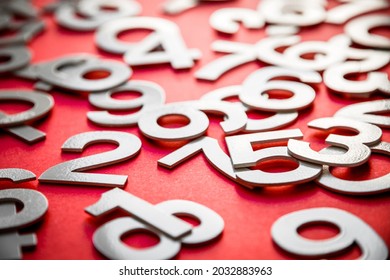 Mathematics background made with solid numbers on a board. Isolated on red