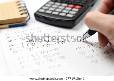 Mathematics geometry handwritten notes and circle diagrams paired with a scientific calculator and a ballpoint pen for college education