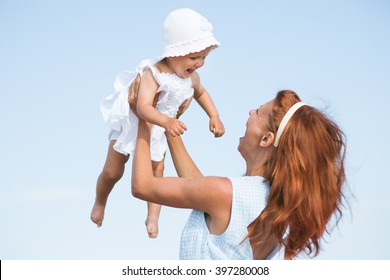 Mather And Baby On The Sea Beach