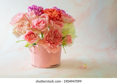 Mather's Day Concept. Colorful Carnation And Pink Rose In A Pink Bucket