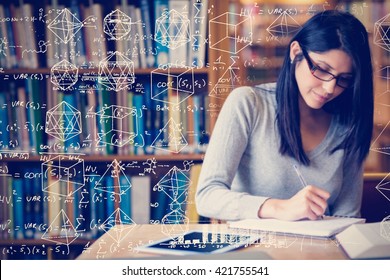 Maths against woman studying in the library