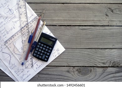 Maths concept background with space for text. Rulers, calculator, pen, compasses and pencil over a sheet of paper with maths-formulas. Mathematical analysis, probability theory. Complex analysis. - Shutterstock ID 1492456601