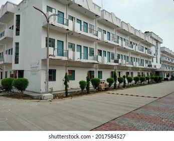 Mathura, Uttar Pradesh India- July 25 2021: New Housing Society For The Middle Class Workers With Balcony Flats And Small Apartments. Hostel Building In College Campus.