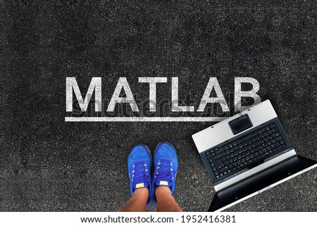 MATLAB programming language. Woman legs in sneakers standing next to laptop and word Matlab