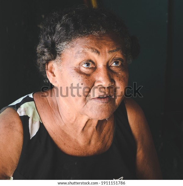 mator lady looking homeless indigenous, smoked with\
sad face and blue eyes