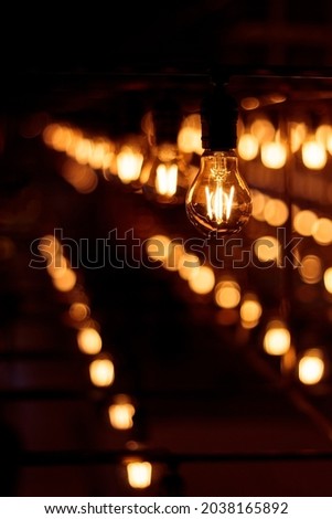 a matrix of warmlight light bulbs 