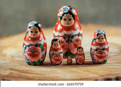 Matryoshka Family. Russian Doll On A Wooden Table. Matrioska Art.