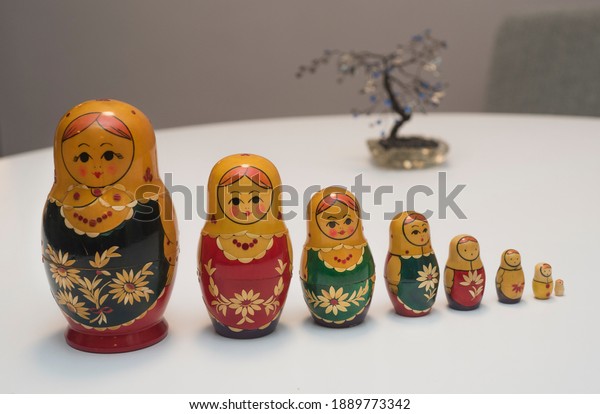 \
\
The matryoshka family and a tree in the background.\
