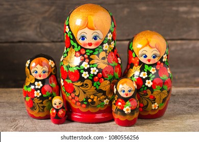 Matryoshka. Russian Folk Toys. On Wooden Background.