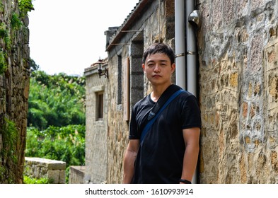 Matsu, Taiwan - JUN 27, 2019: A male tourist in Qinbi Village at Matsu, Taiwan.