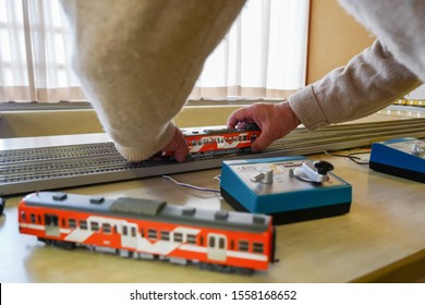 Matsudo, Chiba / Japan - November 3, 2019: An Old Man Hands Holding Model Train On Track In The Cultural Day Exhibition That Held At Matsudo Kogane Citizen Center