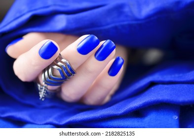 Matte cobalt blue manicured nails isolated on white background. - Shutterstock ID 2182825135