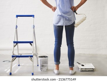 Matte Or Eggshell. Cropped Rearview Shot Of A Woman Holding A Paint Roller.