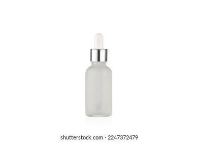 Matte white bottle with dropper on a white background.
Cosmetic bottle. Frosted glass bottle with silver metallic cup.